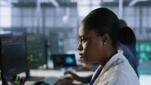 Close Up of Programmer in Data Center Implementing AI Systems