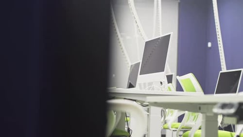 Computer Monitors on Tables in School IT Classroom