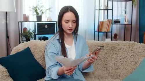 Frustrated Woman Throwing Bills in Living Room