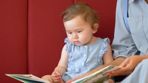 Mother and Infant Reading Picture Book Together