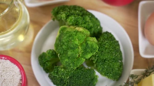 Fresh Broccoli on Plate with Other Ingredients