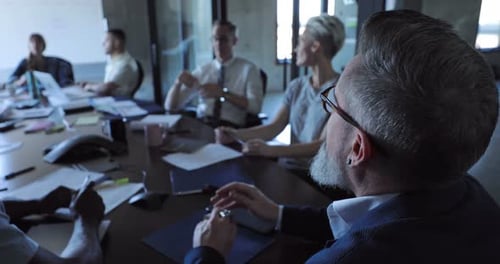 Business people brainstorming strategy in a modern office conference room