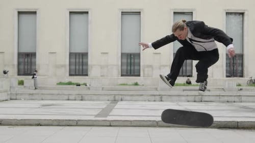 Businessman Performing Skateboard Trick in Suit
