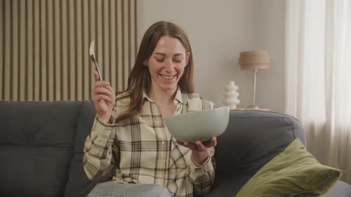 Smiling Woman Eating Healthy Salad at Home