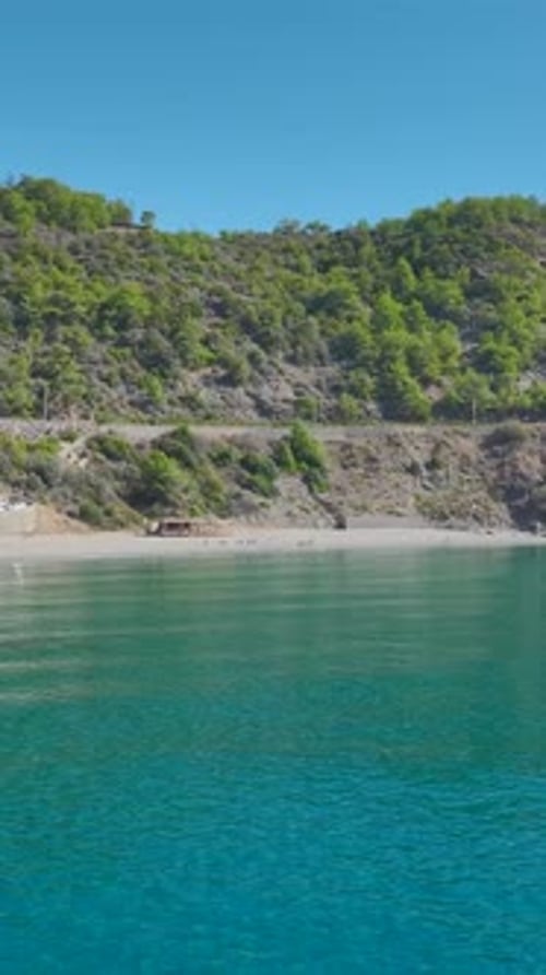 Vertical Video Paddleboard Adventure on the Mediterranean Sea with People Swimming Relaxing and