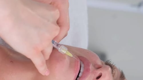 Lip Injection Procedure Close Up in Medical Clinic