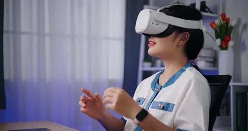 Young Adult Woman Using VR Headset Indoors