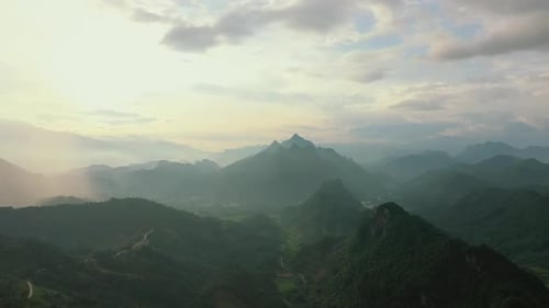 Mountains, green forest and drone with hills, clouds and landscape scenery