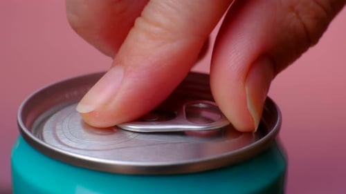 Fingers Open a Tin Can of Drink Close Up