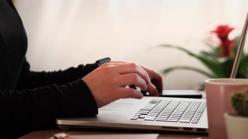Hand Typing On Laptop Smartphone