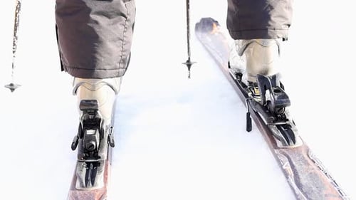 Close-up ski boot stepping in the ski binding. Detailed view of ski bindings concept.Winter activity