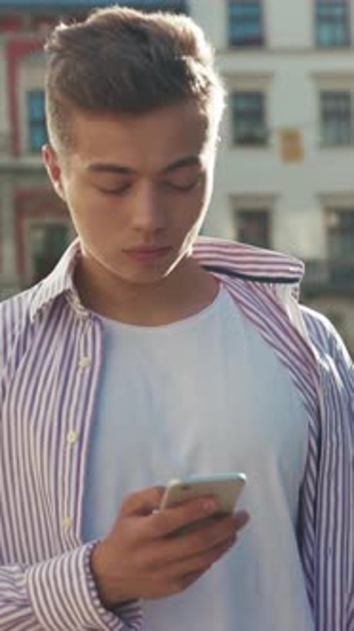 Slow Motion Serious Face Young Serious Man Stand on Street Use Phone Look at Camera Sunlight Work