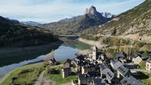 Spanish Pyrenees, Sallent de Gallego Village and Mountain Lake - Aerial 4k