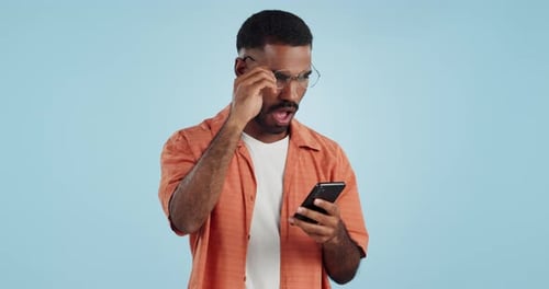 Man Reacts to Content on Phone