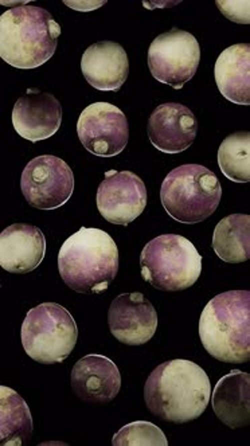 Animated Turnips Falling Against Black Background