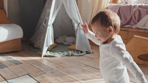 Happy Baby Reaches for Mother in Sunny Room