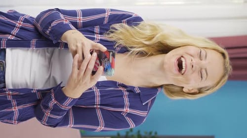 Smiling Woman Using Smartphone Indoors, Vertical Video