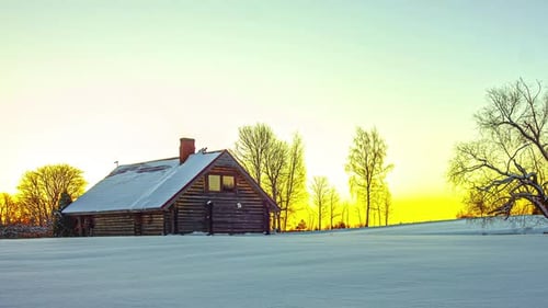 Timelapse of bright rising sun over snowy landscape with wooden hut at sunrise. Night to day and sky