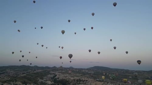 Aerial video over monoliths in Cappadocia, on hot air balloons, Turkey