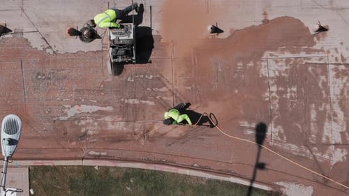 Aerial Shot Over of Road Construction Process Cutting the Road Surface