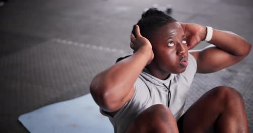Black man, fitness and sit ups on floor for workout, exercise or abdominal or core strength at gym