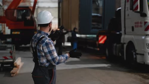Construction Worker Coordinating Modular Home Transportation