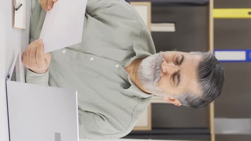 Vertical video of Nervous and thoughtful company executive.