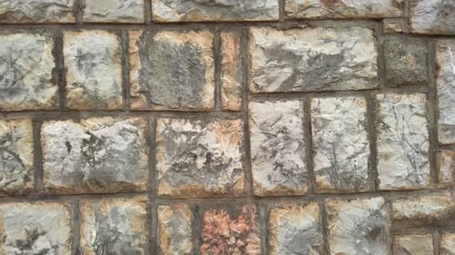 Smooth Camera Movement Capturing Details of a Stone Wall of a Medieval Fortress or Castle