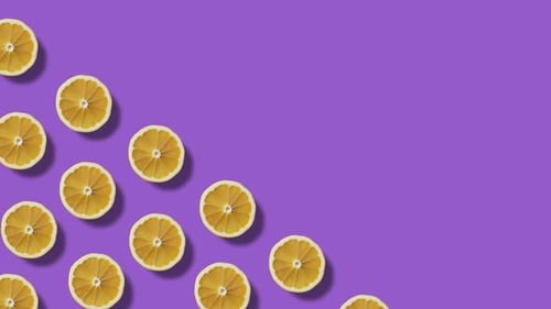 Lemon Slices on Purple Background