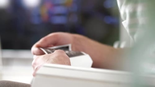 Unrecognizable father tenderly holds in hand ultrasound of future son or daughter