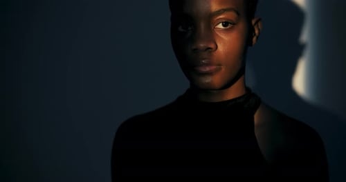 Intense Portrait of Woman in Shadow and Light