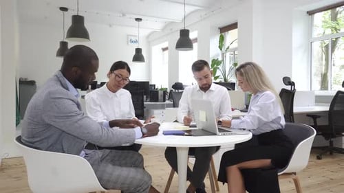 Multiethnic Business People During Meeting in Modern Office