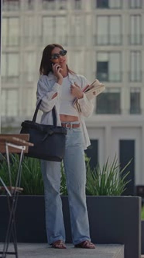 Stylish Woman Talking on Phone on City Street