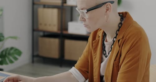 Portrait of Young Businesswoman Using Laptop Typing Concentrated on Ecommerce in Office