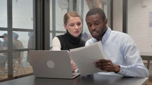 Teamwork in Action: Adults Collaborating in Modern Office