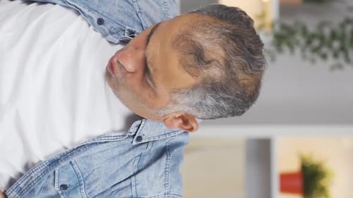Vertical video of Man experiencing stomachache.