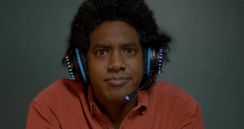 Excited Gamer Winning with Hands Up in Air