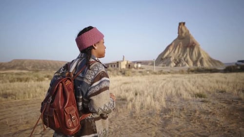 Black Woman Walks Relaxed Observing Nature Outdoors Traveling Happy Girl on Holiday