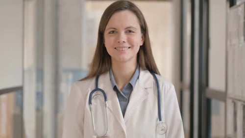 Portrait of Smiling Young Female Doctor Looking at Camera