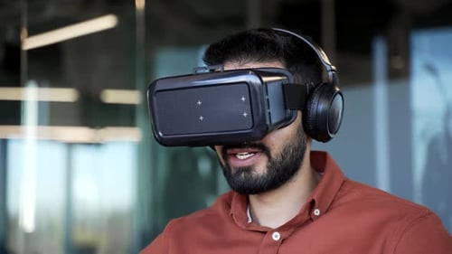 Man Wearing VR Headset in Modern Office