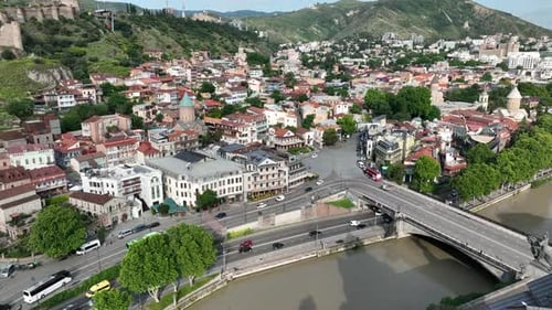 Cars driving over the Metekhi Bridge in the City of Tbilisi, Georgia