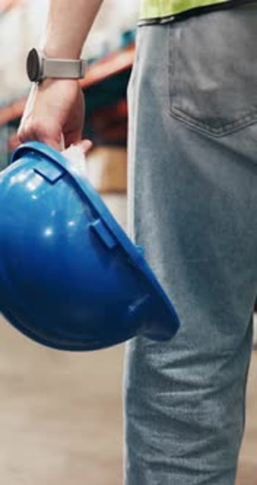 Helmet, walking and hands of man in warehouse for inventory, supply chain and distribution