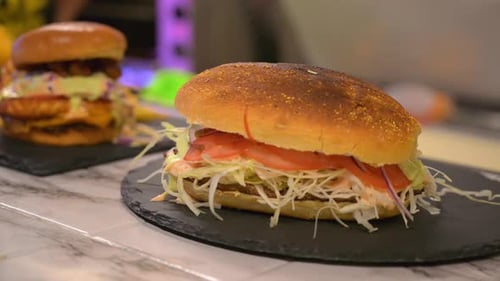 A close-up cinematic shot of a fresh toasted sub sandwich featuring melted cheese, meat, and