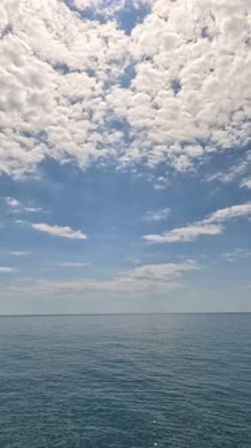 Vertical Aerial View on Sea Water Surface Camera Flies Over Clear Sea Water Sun Glare Abstract