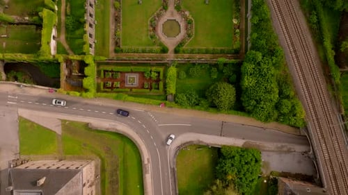 Aerial View of the Well Preserved Ruins and Gardens of Villers Abbey in Belgium with Cars Driving on
