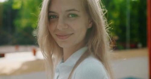 Portrait of Beautifu Fit Girl Walking in Park Looking at Camera and Smile