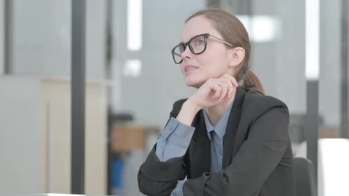 Portrait of Sad Young Businesswoman Crying in Office