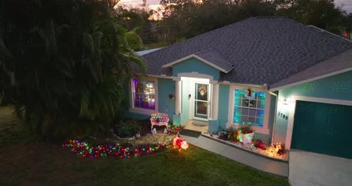 Festive Christmas House at Sunset Aerial View