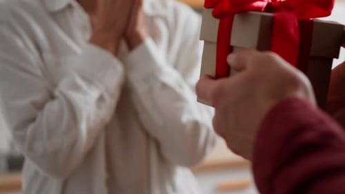 Receiving Gift with Red Bow from Friend