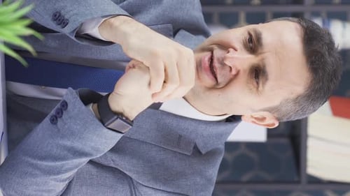 Stressed Adult Man Reacts Negatively in Office Setting